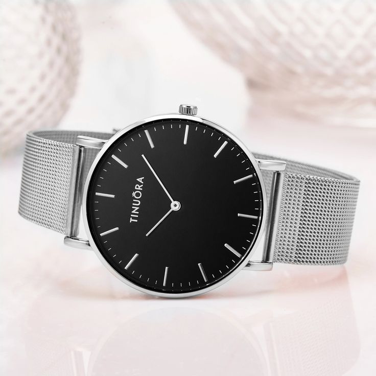 Fashionable Silver Women's Quartz Watch Elevate your style with our luxury metal buckle ladies quartz wristwatch. This elegant timepiece in silver and white exudes simplicity and sophistication. Crafted with precision, the watch features a sleek silver stainless steel band and a clean white dial that complements any outfit. The minimalist design is perfect for both casual and formal occasions. The reliable quartz movement ensures accurate timekeeping, and the metal buckle closure provides a secu Minimalist Silver Analog Watch, Trendy Silver Watch With Metal Dial, Trendy Silver Watch For Formal Occasions, Silver Stainless Steel Quartz Watch, Minimalist Silver Watch With Subdials, Silver Minimalist Watch For Formal Occasions, Timeless Silver Metal Watch Accessories, Silver Minimalist Metal Watches, Silver Minimalist Metal Watch