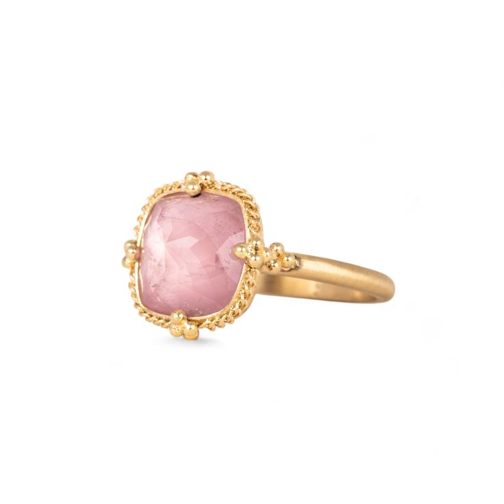 Bringing to mind the first signs of Spring, this Morganite is a lovely shade of petal pink. This ring is complete with a handmade bezel that encases this gem with a yellow gold radiance. One of a kind.Ready to ship in size 7. Please allow 1-2 weeks for any other size. Technical Details Metal: 18k yellow goldMorganite: 4.17 cts. Ring face: 13.5mm x 13.5mmBand width: 2mmHandmade in New YorkStyle # R-2721-MOR Luxury Pink Sapphire Rings With Gemstone, Elegant Yellow Gold Sapphire Cabochon Ring, Elegant Tourmaline Gemstone With Center Stone, Luxury Jewelry With Rose Cut Diamonds And Pink Sapphire, Morganite Fine Jewelry In Yellow Gold, Luxury Tourmaline Rings With Rose Cut Diamonds, Elegant Pink Gold Morganite Rings, Formal Pink Gold Rings With Pink Sapphire, Pink Sapphire Ring With Gemstone Accents