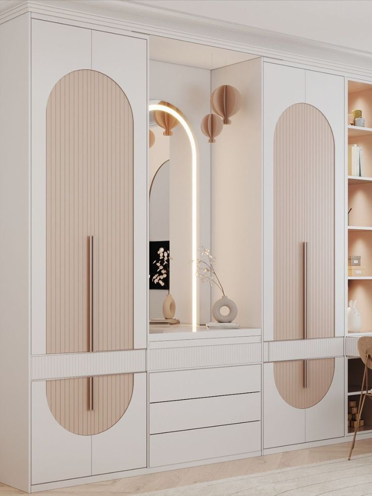 a white and beige bedroom with an arched mirror