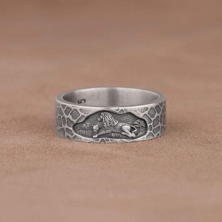 Lion and Lioness Mural Engraved Textured Band Ring, 925 Sterling Silver Animal Art Ring, Handmade Unsual Leo Promise Ring, Cool Wedding Band Made of 925 silver and handcrafted by hand, this ring is not only an accessory piece that complements your daily elegance, but also has details that will reflect your character and style. It is also a great gift to give to your loved ones on their special days. At SavisSilver, we always give importance to the satisfaction of our customers, we recommend you Adjustable Engraved Snake Ring, Engraved Open Skull Ring As Gift, Engraved Skull Open Ring Gift, Engraved Open Skull Ring Gift, Silver Adjustable Engraved Snake Ring, Unique Stamped Antique Silver Rings, Adjustable Engraved Antique Silver Ring, Engraved Snake Ring For Anniversary, Unique Stamped Silver Rings