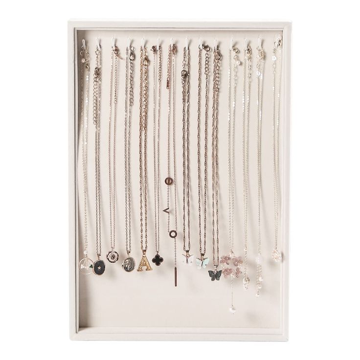 PRICES MAY VARY. Special:Unlike the other necklace holder, you don't have to fold your necklace and put it in a box,You just only hang it. Cute:the white necklace stand is made of lovely beige white flannelette, makes your necklace look unique. Useful:It's stackable, and it works really well. It can hold 14 necklaces. necklace trays T Bar Necklace Holder, Hang Necklaces Diy, Organize Necklaces, Diy Necklace Display, Jewelry Trays, Velvet Necklace, Necklace Storage, Necklace Stand, Jewelry Displays