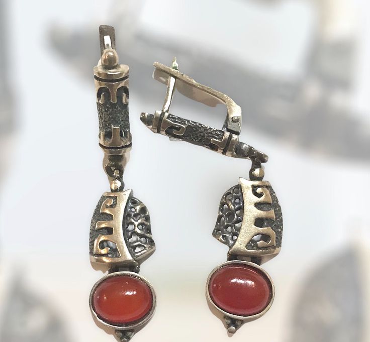 Exquisite handmade silver earrings with semi-precious stone and hieroglyphic carvings. Engraved Metal Earrings For Gift, Engraved Metal Earrings As Gift, Pierced Silver Agate Jewelry, Silver Agate Jewelry, Elegant Engraved Metal Earrings, Elegant Handmade Agate Earrings, Nickel-free Agate Earrings For Gifts, Elegant Silver Carved Earrings, Silver Carved Brass Jewelry