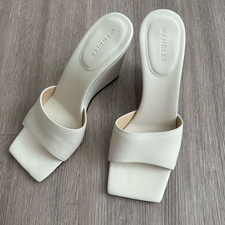 Never Worn, Excellent Condition. Wandler Brand, Leather Wedge, And Size It 37. I’m In Between A Standard Us 6.5-7, And They Fit Perfectly. White Wedge Sandals With Sculpted Heel, White Wedge Heel Sandals With Sculpted Design, White Wedge Heel Sandals With Sculpted Heel, Formal Spring Wedge Sandals With Square Toe, Elegant Square Toe Wedge Sandals, Chic Formal Wedge Sandals With Square Toe, Chic Formal Square Toe Wedge Sandals, Cream Wedge Sandals With Heel Loop, Elegant Wedge Sandals With Contrasting Heel Counter