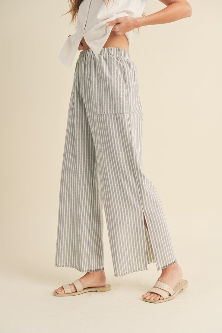 DescriptionThe Seaside Striped Linen Pants feature: Raw edge Side pockets Side slits Wide leg Elastic waistband FitRelaxed, true to size MaterialLinen / Cotton Restrictive Clothing, Unique Pants, Striped Linen Pants, Unhealthy Obsession, Unisex Clothes, Cotton Trousers, Pants Large, Capri Blue, The Seaside