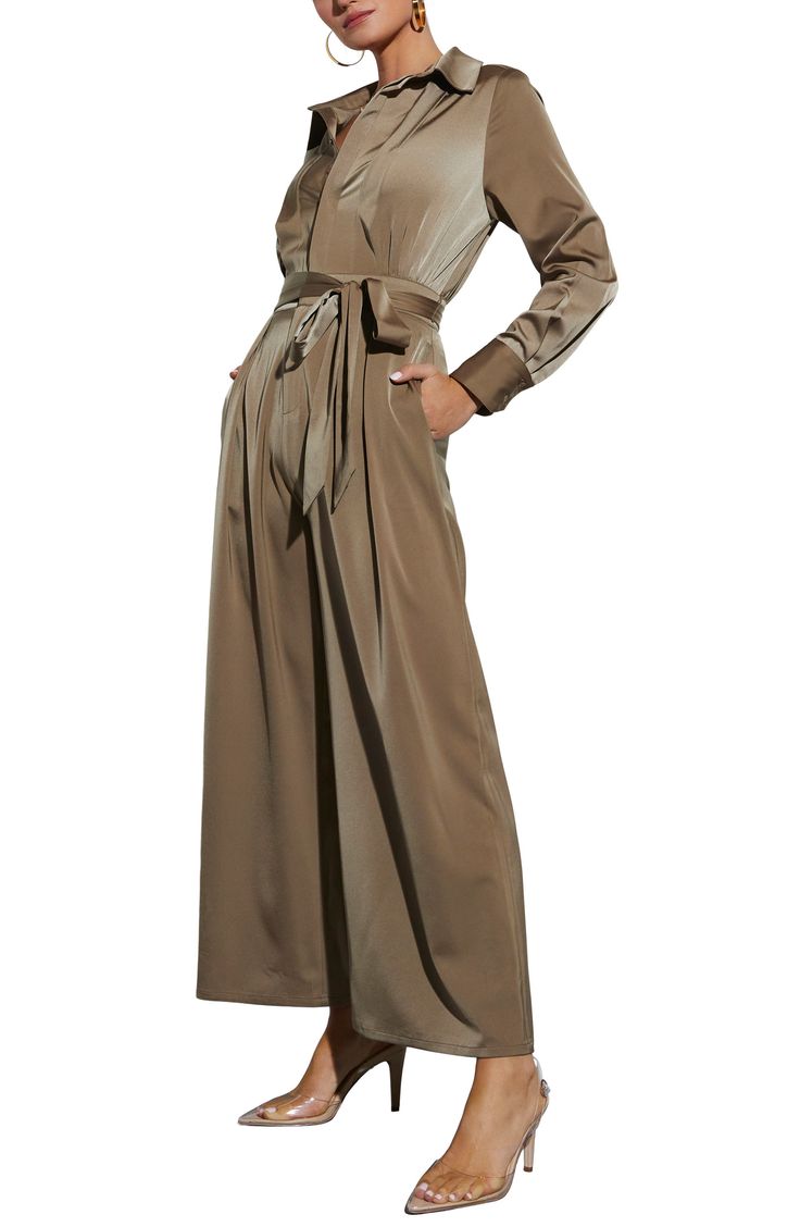 Classic sophistication defines this glossy satin jumpsuit designed with a waist-defining sash and flowy wide legs. Hidden-button placket; zip fly Spread collar Long sleeves with two-button cuffs Side-seam pockets; back welt pockets Removable sash Unlined 100% polyester Hand wash, line dry Imported Elegant Belted Solid Jumpsuits And Rompers, Elegant Fall Jumpsuits And Rompers With Tie Waist, Elegant Jumpsuits With Belted Cuffs, Solid Belted Jumpsuits And Rompers For Fall, Fall Solid Color Belted Jumpsuits And Rompers, Elegant Long Sleeve Jumpsuits And Rompers With Tie Waist, Belted Wide-leg Jumpsuit For Work, Wide-leg Belted Jumpsuit For Work, Belted Wide Leg Jumpsuits For Work