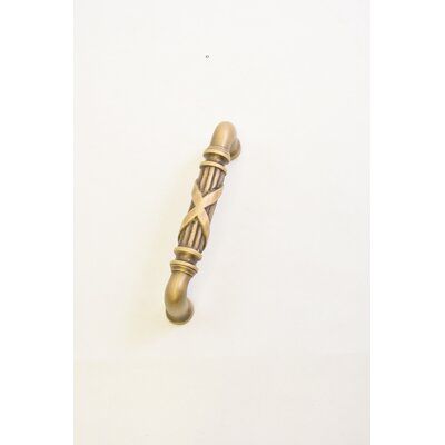 an antique brass door handle on a white background