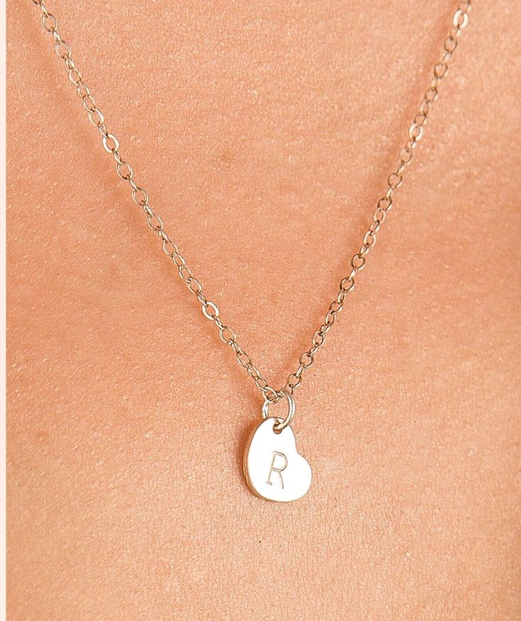 Tiny Sterling Silver Initial Heart Necklace. I love how simple and dainty this necklace is. You can choose to personalize the heart with an initial or just leave it blank. Makes a great gift from the ❤️. All components are Sterling Silver. Heart Initial Necklace, Dainty Heart Necklace, Silver Heart Jewelry, Heart Necklace Silver, Initial Heart Necklace, Sterling Silver Initial, Jewelry Personalized, Silver Heart Necklace, Necklace Dainty