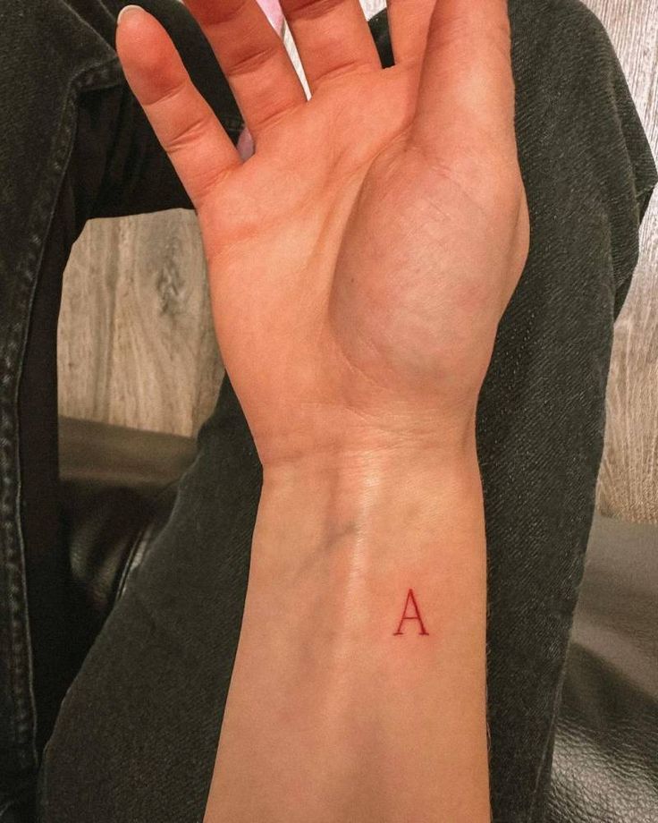 Letter A Initial Tattoo, Red Ink Letter Tattoo, Red Initial Tattoo, Small A Tattoo Letter, Initial Tattoo Men, Initial Tattoo Wrist, Red Tattoos Men, Letter Fonts Tattoo, Initial Tattoo A