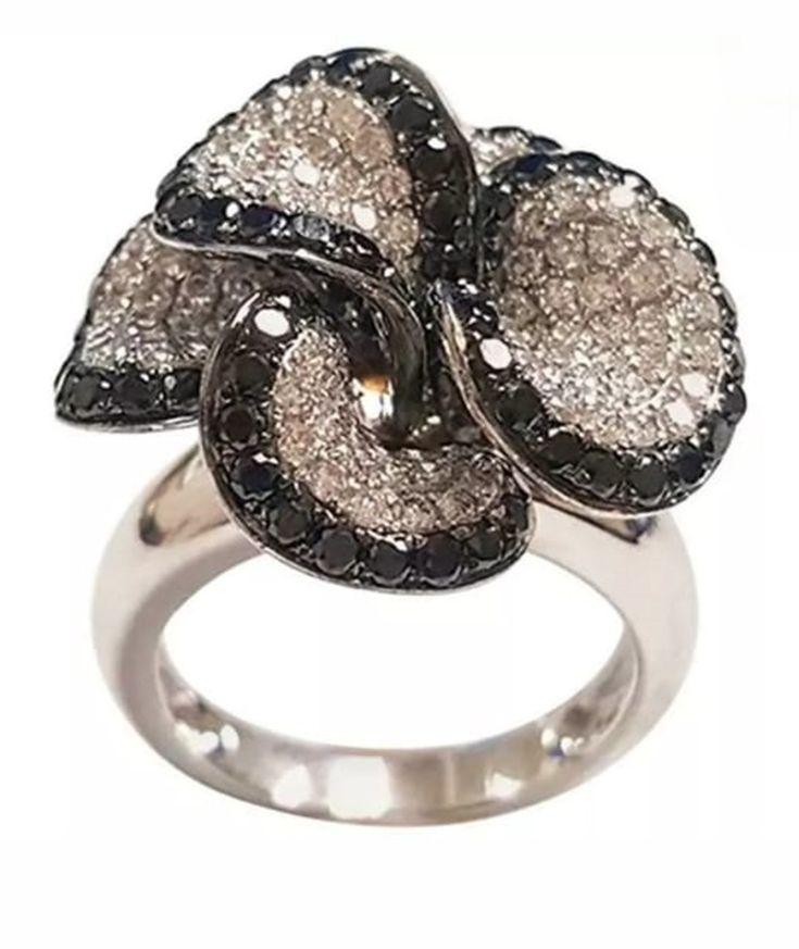 a white and black diamond flower ring