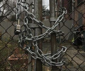 a chain link fence with two padlocks attached to it