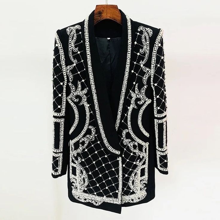 Gorgeous black rhinestone and pearl embellished blazer dress. Add some class and sass to your wardrobe with this stunning blazer dress.  * Sizing - All items are made according to measurement ranges, they are NOT typical letter or numeric sizing. It is imperative to compare your exact measurements with the size chart provided either in the listing photos or item descriptions and to also add your measurements under Personalization. If you have any questions on sizing, please feel free to message me. Do not order your normal size without taking and comparing measurements. * Made to order items such as feather tops, jackets, dresses and rhinestone/crystal dresses are NON-REFUNDABLE/EXCHANGEABLE. If you have a problem with your order, please contact me and I will do my best to rectify the prob Pearl Blazer, Rhinestone Blazer, Beaded Blazer, Black Blazer Dress, Short Coats Women, Dress With Shawl, Fashion Beads, Pearl Design, Women Shawl