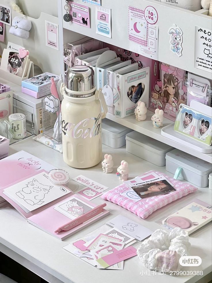 a desk with many items on it including cards, pictures and other things in the room