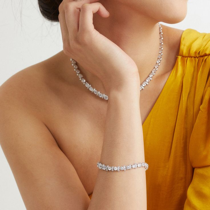 ABOUT THE PRODUCTA modern classic, this stunning tennis bracelet features an alluring mix of dazzling cubic zirconia stones, adding a touch of elegant glamour to any look. Metal: BrassPlating: 18KT Gold or RhodiumStones: Cubic ZirconiaLength: 7.25 in Formal Tennis Necklace With Rhinestones, Dazzling Cubic Zirconia Tennis Necklace, Dazzling Cubic Zirconia Tennis Necklace For Everyday Luxury, Everyday Luxury Cubic Zirconia Tennis Necklace, Elegant Round Tennis Necklace With Rhinestones, Sparkling Stones Tennis Bangle Bracelet, Luxury Silver Tennis Bracelet With Sparkling Stones, Elegant Sparkling Diamond Bracelet, Elegant Diamond Bracelets With Sparkling Stones