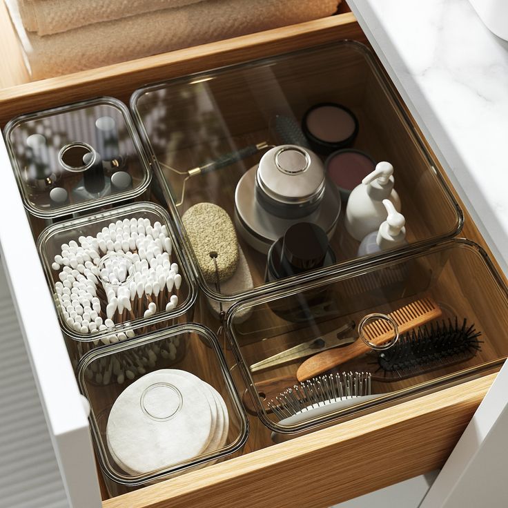 the drawers are organized with various items such as brush, combs and hairdryer