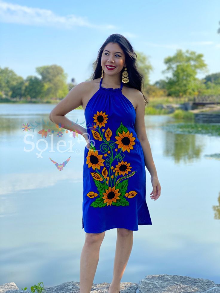 -This Beautiful Floral embroidered Dress is the perfect dress to add to your wardrobe. Its cute enough to dress up for a party or even just wear it to a picnic. -It's lightweight, handmade out of cotton and has embroidered sunflowers on it. **More colors available here: https://www.etsy.com/es/listing/839953944/vestido-halter-girasoles-vestido?ref=listing_published_alert Embroidered Sunflowers, Mexican Dress, Floral Halter Dress, Mexican Dresses, Authentic Mexican, Floral Embroidered Dress, Bridal Shower Theme, Babydoll Dress, Embroidered Dress