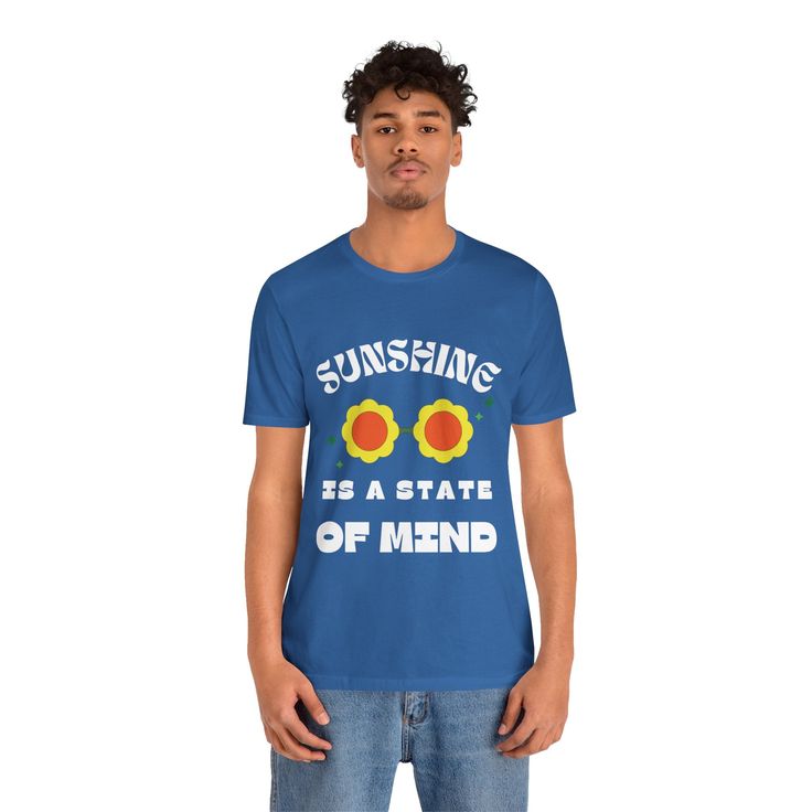 a man wearing a blue t - shirt that says sunshine is a state of mind