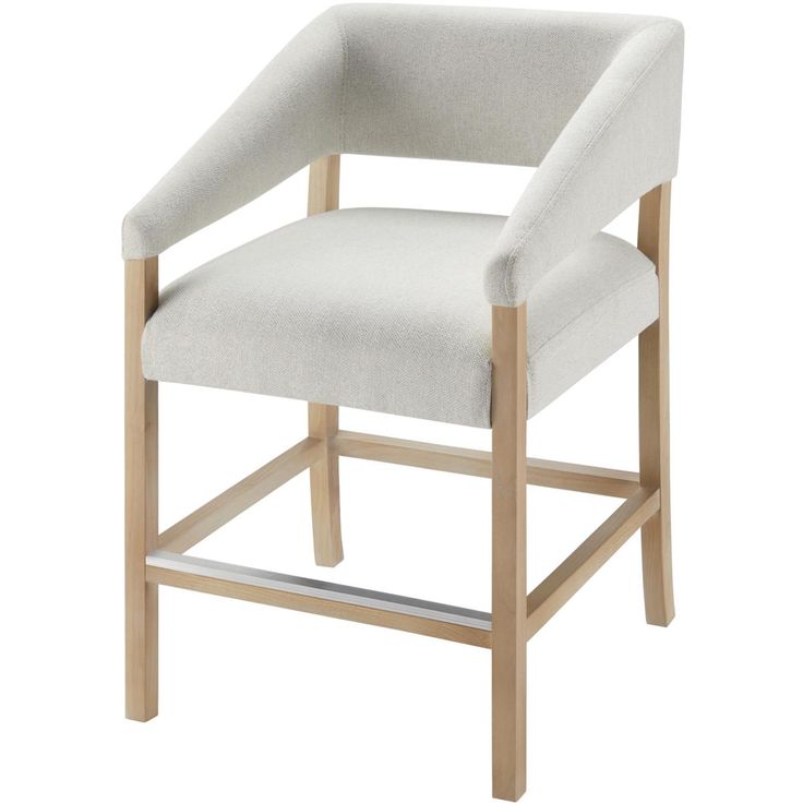 an upholstered chair with wooden legs and a white fabric seat pad on a white background