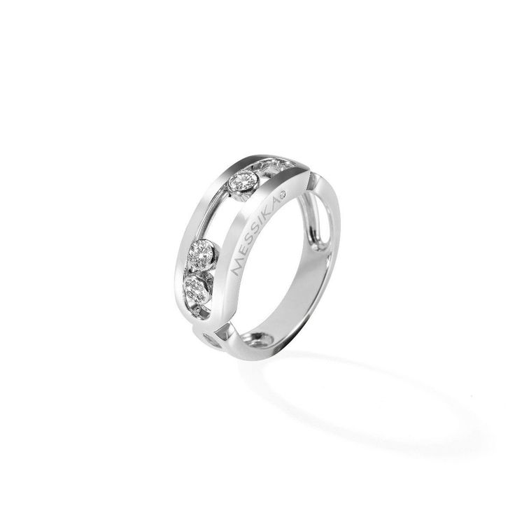 a white gold ring with three diamonds on the inside and outside, set in 18k white gold