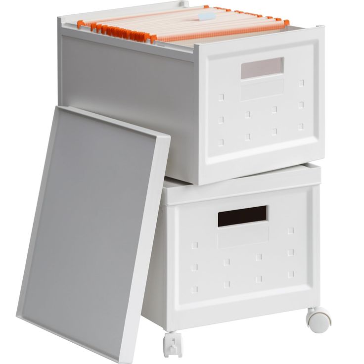 two white boxes with orange handles on each side and an open drawer in the middle