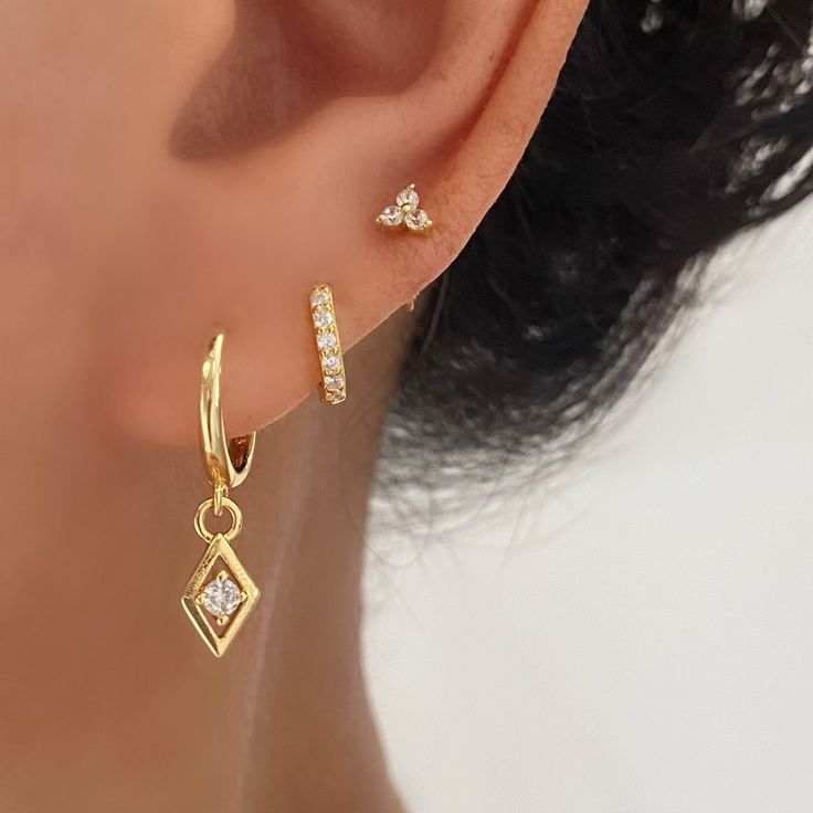 Minimalist Sterling Silver with 18k gold plated Huggie Dangly Stud Earrings set. Perfect for a gift for your loved ones or for yourself. Come in 2 different Sets.A+B+C SET with a gift boxA+C SETA. Gold Dangle Earrings. 18k gold plated on brass, 925 sterling silver post.-measurements: length-23 mm, hoop inner diameter- 9.5 mmB. Gold huggie hoop 7mm. 925 Sterling Silver with 18k gold plated.-measurements: Hoop outer diameter: 9.7mm , Hoop inner diameter: 7mmC. Gold Stud Earrings. 925 sterling silv 2 Stacked Earrings, Gold Hoop Earrings Set, Gold And Silver Jewelry Together Ear, Elegant Ear Piercings Classy, Gold Earrings Set Of 3, Gold Plated Drop Earrings With Matching Set, Tripple Earring Set, 2nd Ear Piercing, Gold Earring Set