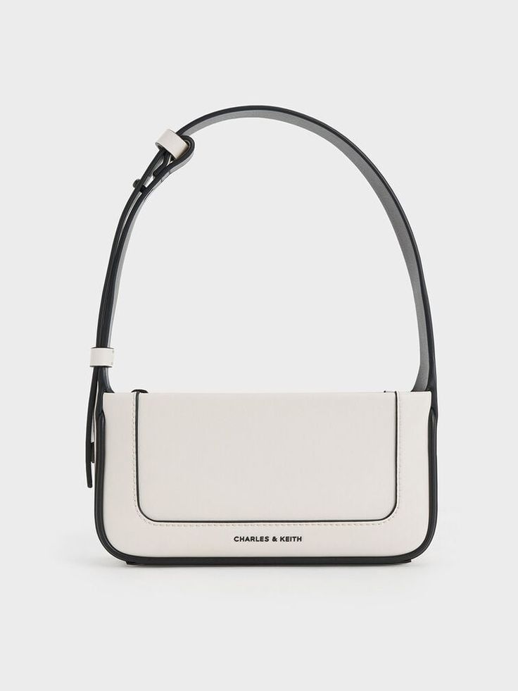 This product is made with at least 20% sustainable materials by weight. CHARLES & KEITH uses recycled, degradable, organic, and water-based materials in our eco-conscious collection. This season, the Daylla returns in a more compact and sleek silhouette that is great for casual days. Featuring the same rectangular and structured silhouette as the Daylla tote, this piece is a smaller iteration that is just nice for holding your most-used essentials. It also comes with a contrast stitch-trim detail that stands out against the cream finish. Plus, the shoulder strap is also adjustable so you can wear it as a shoulder bag or longer crossbody bag, depending on your preference. Charles And Keith Bags, Designer Bags Black, Glossier Bag, Charles And Keith, Classy Purses, Cream Bag, Black And White Bags, Sling Bag Black, Cream Bags