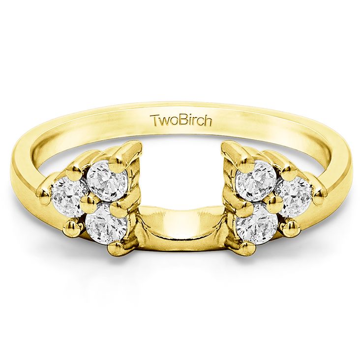 a yellow gold ring with three diamonds on it