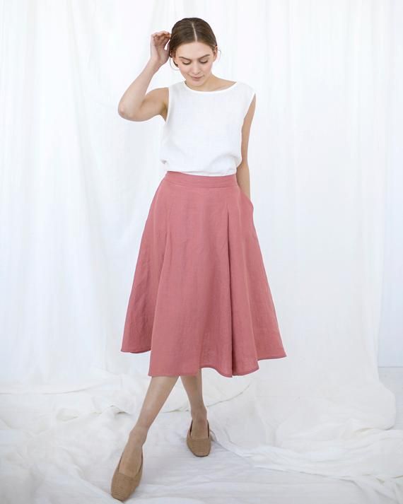 Pink Linen Skirt, Blush Midi Skirt, Linen ClothingD E S C R I P T I O N- Half-circle cut- An elastic waistband (medium high-waist)- Pockets in side seams- Midi lengthD E T A I L S- Name: LINDOS- Sizes: XS - XXL- Color: Mustard, Dusty peach, Salmon, Terracotta, Burgundy red, Cacao, Pine green, Chartreuse green, Milky white, Dusty Lavender, Light Grey, Mint, Sky blue, Blue, Deep blue, Striped grey, Grey, Charcoal grey, Black.- 100% European soft and washed linen fabric (weight 206 g/m² | 6.49 oz/y Summer Long Pleated Skirt With Pleated Hem, Summer Pleated Long Skirt, Summer Full Skirt With Pleated Hem, Summer Long Skirt With Pleated Hem, Flowy Pink Pleated Skirt, Pink Flowy Pleated Skirt, Chic Summer Pleated Culottes, Summer Full Pleated Skirt With Pockets, Summer Midi Skirt With Pleated Hem