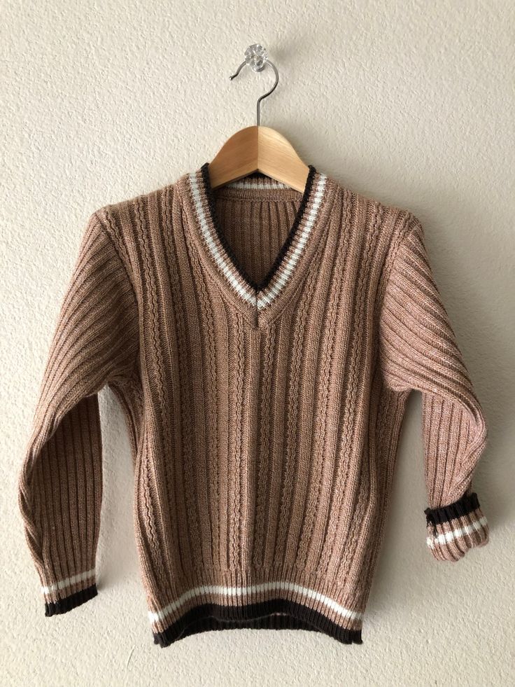 A fantastic 1960s sweater featuring a cable knit design and V neckline. In excellent condition!  No stains, snags etc. Would look amazing layered or by itself. No tags, but most likely will fit a range from 4T-5. As always, please see pictures of approx. measurements.    Feels to be an acrylic/wool blend~ +Why buy Vintage? Aside from owning something most likely is one of a kind; it is also a great opportunity for optimal recycling - a great way to not add to the mass overproduction, and to help Retro Long Sleeve Ribbed Sweater, Retro Ribbed Knit Sweater, Vintage V-neck Knit Sweater, Retro Cable Knit Sweater For Fall, Vintage Winter Sweater With Ribbed Cuffs, Vintage Knit Sweater With Ribbed Collar, Retro Brown Knit Sweater, Retro Long Sleeve Cable Knit Sweater, Brown Retro Knit Sweater