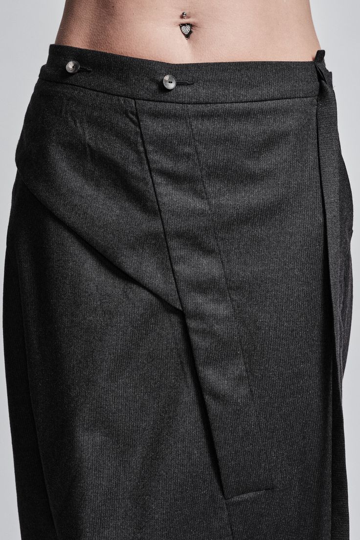 "Drop Crotch Trouser with Asymmetrical Front Closure__ // EXPRESS DELIVERY ONLY __Elastic Backside Waistband with Belt __2 Front Pockets __2 Rear Pockets __Asymmetrical Hidden Front Closure __Lightweight Wool Fabric model__ bust 92 (36\"), waist 72 (28\"), hips 102 (40\"), biceps 28 (11''), height 177 (5'8\"), kg 65 (143 lbs) model wears size M | color: dark grey fabric__ 100 wool care__ dry clean sizing__ size XS (US 4, EU 34, IT 40, UK 8) bust: 79-84 cm / 31\"-33\" waist: 60-65 cm / 23.5\"-25. Asymmetrical Skirt With Belt Loops For Work, Formal Bottoms With Asymmetrical Hem, Workwear Bottoms With Belt Loops And Asymmetrical Hem, Asymmetrical Hem Bottoms With Belt Loops For Work, Formal Bottoms With Fitted Asymmetrical Hem, Formal Fitted Bottoms With Asymmetrical Hem, Elegant Asymmetrical Bottoms With Pockets, Elegant Asymmetrical Hem Work Pants, Versatile Workwear Bottoms With Asymmetrical Hem