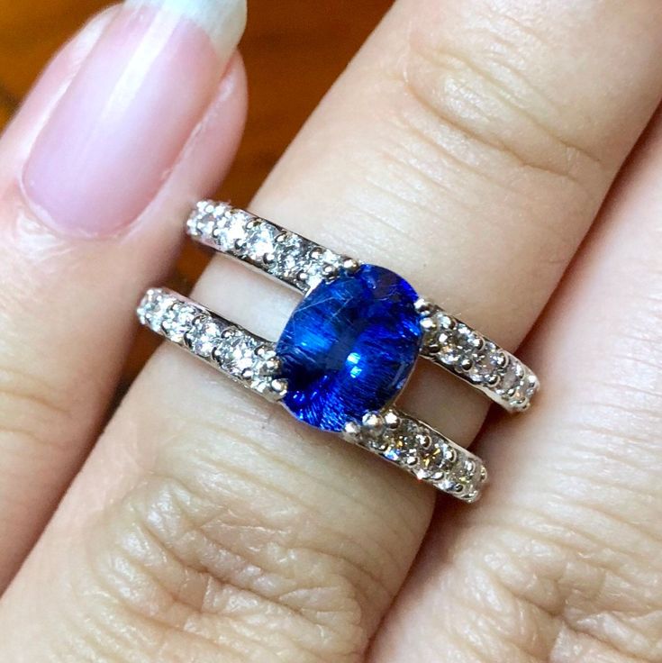 SUGGESTED RETAIL VALUE: $9,500 HEIRLOOM QUALITY! Rare and beautiful CEYLON BLUE SAPPHIRE, SLIGHTLY INCLUDED, 100% Transparent CEYLON Sapphire surrounded by top-grade E/VS diamonds! MODERN AND ELEGANT, SPECIAL design! Eternity bands! Extra special! Ceylon Sapphire are one of the rarest gemstones in the world, desperately desired by many collectors, and here we are! Presenting you with one of the finest and rarest gems on earth. With its vivid blue color and TRANSPARENT, FINE quality, this SPARKER Gia Certified Blue Rings, Rarest Gemstones, Ceylon Blue Sapphire, White Gold Earrings Studs, Ceylon Sapphire, Blue Sapphire Diamond, Vs Diamond, Rare Gems, Rare Gemstones