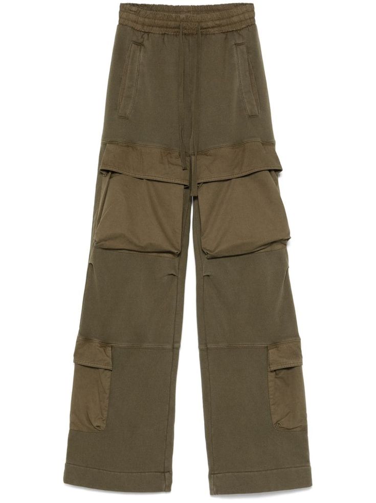 khaki organic cotton jersey texture drawstring fastening elasticated waistband two side welt pockets multiple cargo pockets two rear welt pockets wide leg This item is made from at least 50% organic materials. When buying this unisex item, keep in mind that it is graded in standard men's sizing. Utility Wide Leg Cargo Style Sweatpants, Utility Style Sweatpants For Loungewear, Utility Wide Leg Cargo Sweatpants, Utility Cargo Style Wide Leg Sweatpants, Khaki Sweatpants With Pockets For Streetwear, Baggy Parachute Pants With Cargo Pockets For Loungewear, Wide-leg Parachute Pants With Cargo Pockets For Loungewear, Khaki Utility Cargo Style Sweatpants, Khaki Oversized Pants With Pockets