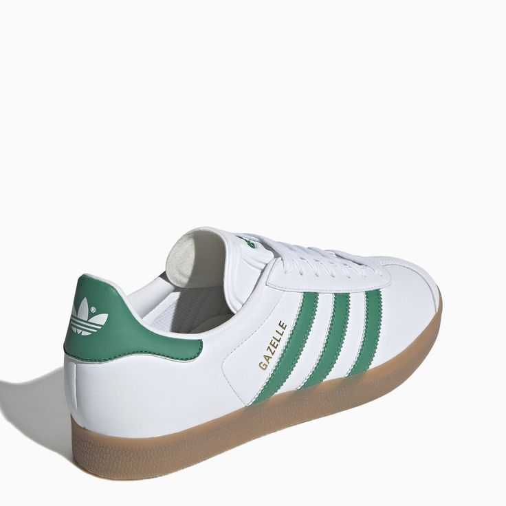 White leather trainer from adidas Originals featuring a round toe, green leather side stripes, a lace-up fastening, a branded tongue and a natural rubber sole. Fit: Buy one size larger than your usual size.Leather upper/ Rubber sole Custom Adidas Logo Leather Lace-up Sneakers, Adidas Logo Leather Lace-up Custom Sneakers, Classic Adidas Leather High-top Sneakers, Green Leather Sneakers For Sports, Green Low-top Sneakers With Rubber Sole, Classic Adidas Leather Sneakers, Classic Leather Adidas Sneakers, Green Adidas High-top Lace-up Sneakers, Green Low-top Skate Shoes With Contrast Sole