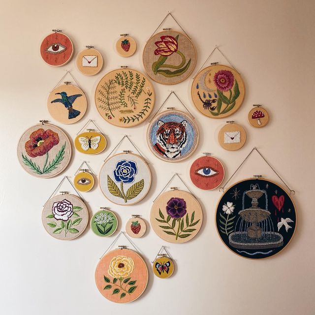 a wall hanging with many different designs on it