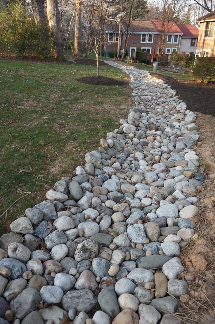 a stone path in front of a house