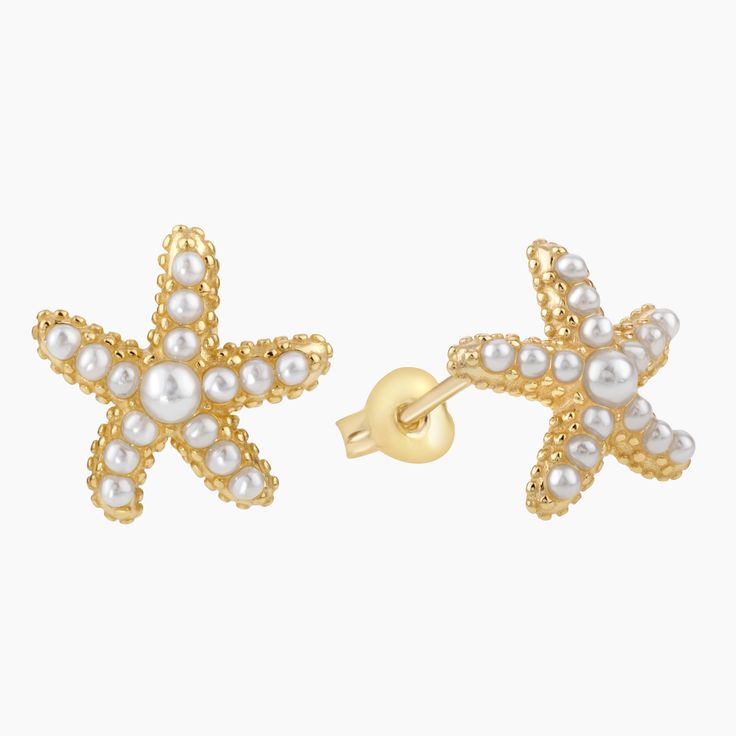 Dive into elegance with our Sea Star Stud Earrings, beautifully plated in gleaming gold over sterling silver. Each earring captures the delicate allure of the ocean's star, adorned with lustrous micro bead pearls. These earrings seamlessly blend timeless appeal with nature's charm, making them a perfect accessory for both day and night. Celebrate the beauty of the sea and make a sophisticated statement with these captivating studs. Elegant Starfish-shaped Pearl Charm Jewelry, Elegant Star-shaped Gold Plated Earrings, Elegant Gold-plated Star Earrings, Elegant Gold Star Earrings, Elegant Gold Plated Star Earrings, Elegant Star-shaped Pearl Earrings, Elegant Star-shaped Pearl Drop Earrings, Elegant White Star-shaped Pearl Earrings, Sea Star