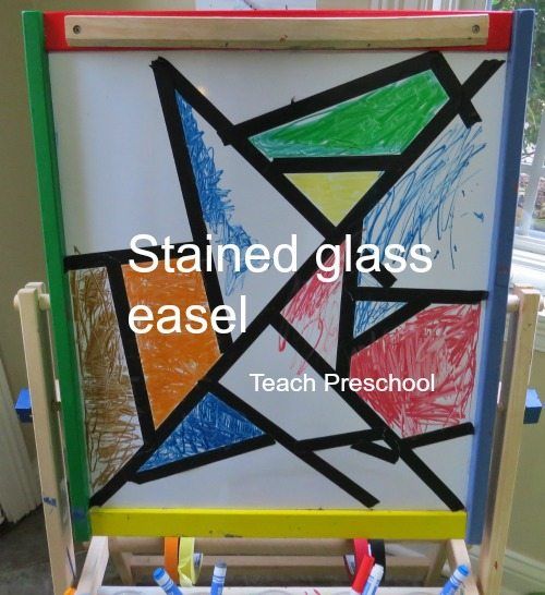 an easel with colored pencils on it and the words stained glass easel