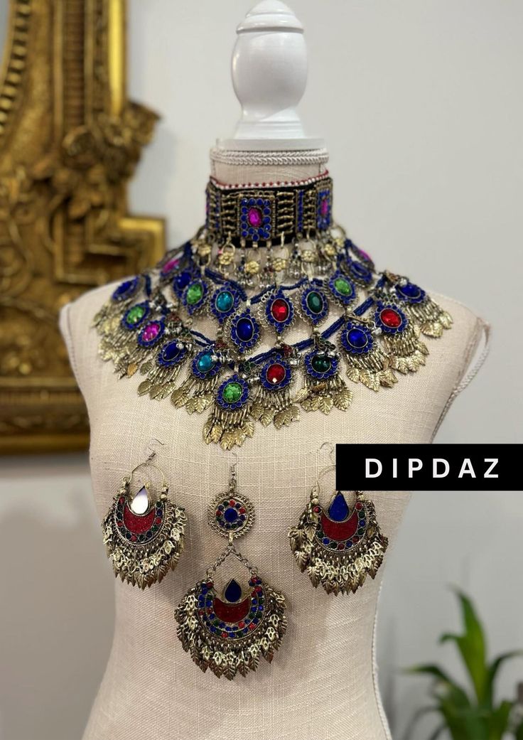 Exquisite Afghan Ethnic Jewelry - Handcrafted Tribal Elegance Original sets Explore the timeless beauty and intricate craftsmanship of our Afghan ethnic jewelry collection at Dipdaz. Each piece in our collection is a unique work of art, meticulously handcrafted by skilled artisans using traditional techniques passed down through generations. Our jewelry features a stunning array of vibrant gemstones, intricate metalwork, and authentic tribal designs, making every piece a true statement of cultur Multicolor Bohemian Jewelry With Intricate Design, Multicolor Metal Jewelry With Intricate Design, Bohemian Heavy Ceremonial Jewelry, Ceremonial Multicolor Metal Jewelry, Multicolor Intricate Jewelry For Navratri, Multicolor Intricate Design Jewelry For Navratri, Multicolor Jewelry With Intricate Design For Navratri, Bohemian Silver Jewelry Sets With Stone Work, Elegant Festival Jewelry With Stone Work