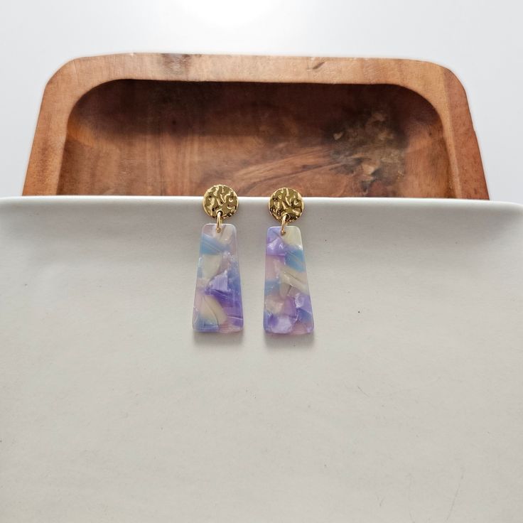 Our Mia Mini Earrings feature a fun pop of color with gold stud accents. These dainty earrings make the perfect finishing touch to any outfit, while still being small and delicate enough to wear every day. 18K gold-plated hypoallergenic stainless steel posts 10mm posts Lightweight and durable plant-based acrylic Trendy Hypoallergenic Purple Earrings, Purple Minimalist Earrings For Pierced Ears, Trendy Purple Earrings For Everyday Wear, Purple Minimalist Pierced Earrings, Purple Minimalist Earrings, Minimalist Purple Earrings, Everyday Purple Drop Earrings, Mini Earrings, Gold Stud