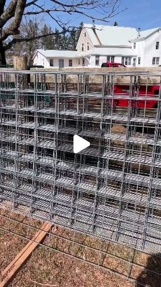 a large metal cage sitting in the middle of a yard