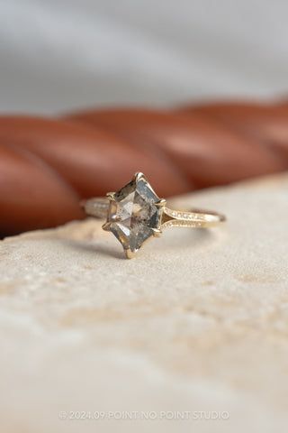 an engagement ring sitting on top of a table