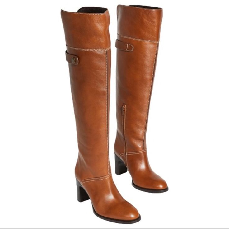 Annia High Boot In Shiny Texan Calfskin With A Contrasting Top Flap That Can Be Worn Down Or Up For An Over-The-Knee Boot. Curved Lines And Contrast Topstitching Are Combined With A Sleek, Elevated Heel Features A Functional Side Half-Zip Closure, Almond Toe, Cutout Detail At Back Topline, Functional Snap Strap At Back Boot Shaft, And 3.25" Stacked High Heel. Condition: New Without Box. Approximate Measurements: 3.25" Stacked High Heel 18.5" Shaft Height 15.25" Circumference Fits True To Size Le Brown Leather Heeled Boots With Buckle, Cognac Leather Heeled Boots For Work, Leather Heeled Boots With Buckle And Almond Toe, Knee-high Cognac Leather Boots, Classic Cognac Calf Leather Heeled Boots, Elegant Leather Heeled Boots In Cognac, Chloe Boots, Contrast Topstitching, Chloe Brown