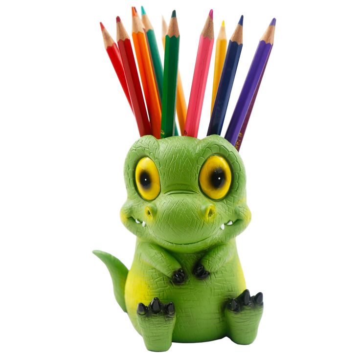 a green toy with colored pencils sticking out of it's head and eyes