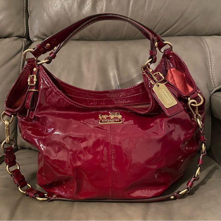 Absolutely Stunning Crimson Red Patent Leather Coach Piece! Madison Sophia Horse And Carriage Line. Beautiful Condition. Clean Interior And Exterior. Can Be Worn As A Hand Bag Satchel Or As A Crossbody Purse. Please See All Photos! Dimensions: 17 Inches Long X 12 Inches Tall. Handle Drop 8 Inches. Long Strap Drop 12 Inches -Please Note Measurements Are Done By Hand And Approximate! Get This Beautiful Bag Now And Pay Later Using Affirm Available At Checkout! Red Satchel, Red Leather Bag, Horse And Carriage, Patent Leather Bag, My Shopping List, Red Purses, Leather Coach, Crimson Red, Cute Bags