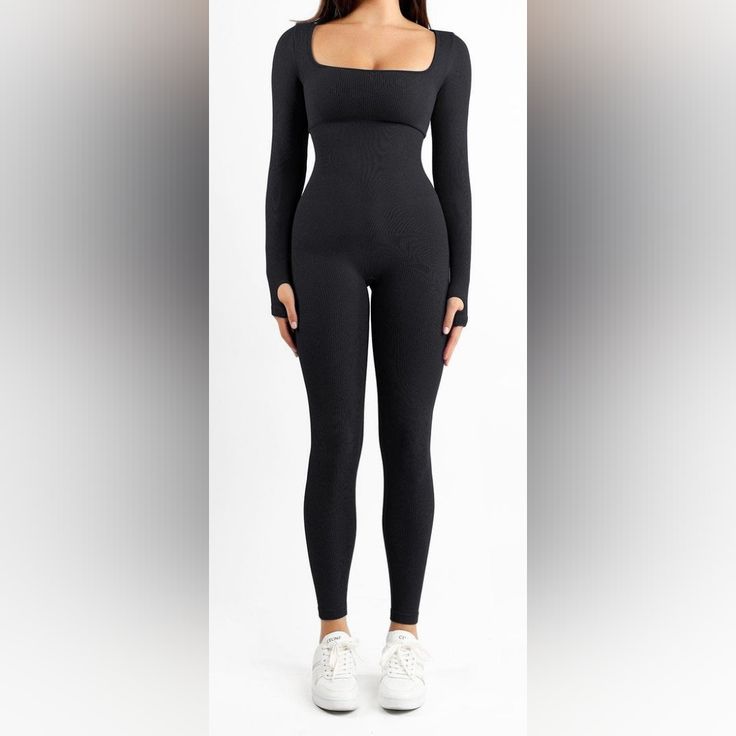 The Popilush Seamless Thumb Hole Square Neck Long Sleeve Jumpsuit Is Simple But Trendy For Any Occasion, Such As Beach, Club, Night Out, And Daily Life. Tighter Fabric On The Waist And Abdomen To Increase Body-Con Fit. The Thumb Hole Covers The Cuff. Its Fabric's Unique Stretch Further Ensures The Flexibility Of The Finger And Can Prevent Wrist Contusion. Double-Layer Removable Bra Pads For Your Bra-Less Style. Elastic And Soft Fabric For All-Day Wearing. High Square-Neck Design To Showcase Your Neckline. Black High Stretch Seamless Jumpsuits And Rompers, High Stretch Seamless Black Bodysuit, Black Seamless High Stretch Bodysuit, Seamless Black Bodysuit With High Stretch, Black Seamless High-stretch Bodysuit, Black Seamless Athleisure Bodysuit, Black Seamless Bodysuit In Athleisure Style, Fitted Black Seamless Bodysuit, High Stretch Black Bodysuit With Seamless Construction