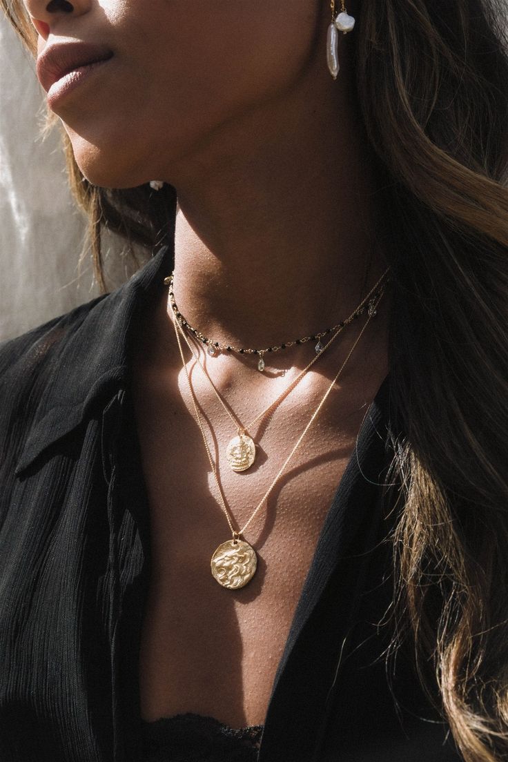 Coin replica necklace with an ancient Greek coin of a lion's head. Lion's symbolism revolves around great strength, leadership, and protection. They've been historically seen as signs of royalty and are often depicted as an emblem of sovereigns, guardians of palaces, doorways, shrines, and thrones. The Lion's Gate is now the popular name for the main entrance of what used to be the Bronze Age citadel of Mycenae in southern Greece. ✦ Adjustable chain measures 22 inches / 14K GF ✦ Pendant measures Symbolic Bronze Jewelry With Coin Pendant, Symbolic Medallion Coin Pendant Jewelry, Spiritual Black Coin Pendant Jewelry, Coin Pendant Medallion Amulet Jewelry, Black Amulet Necklace With Coin Pendant, Black Spiritual Jewelry With Coin Pendant, Black Spiritual Necklace With Coin Pendant, Bronze Coin Pendant Necklace, Black Coin Pendant Jewelry