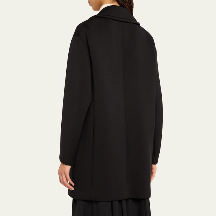 Max Mara "Gradi" top coat in a cotton blend  Notched lapel collar  Two-row button front  Long sleeves Side slip pockets  Mid-length  Relaxed fit  Cotton/viscose Imported