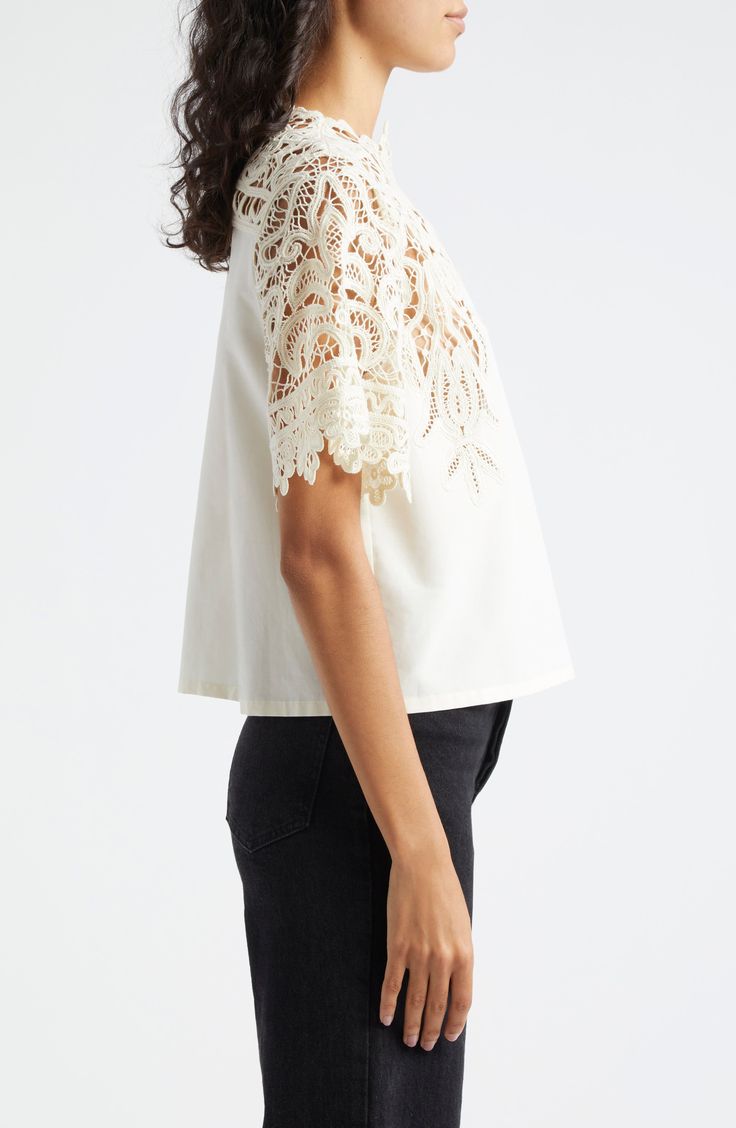 A graceful swirling pattern in guipure lace comprises the yoke and sleeves of this elegant cotton-and-silk top. 22" length (size 8) Back keyhole with button-and-loop closure Jewel neck Short sleeves 70% cotton, 30% silk Dry clean Imported Elegant Short Sleeve Tops With Scalloped Lace, Elegant White Tops With Scalloped Lace, Elegant Short Sleeve Lace Tops, Chic Embroidered Top With Lace Trim, Chic Embroidered Fitted Top With Lace Trim, Spring Formal Tops With Scalloped Lace, Formal Spring Tops With Scalloped Lace, Spring Evening Top With Scalloped Lace, Evening Tops With Scalloped Lace For Spring