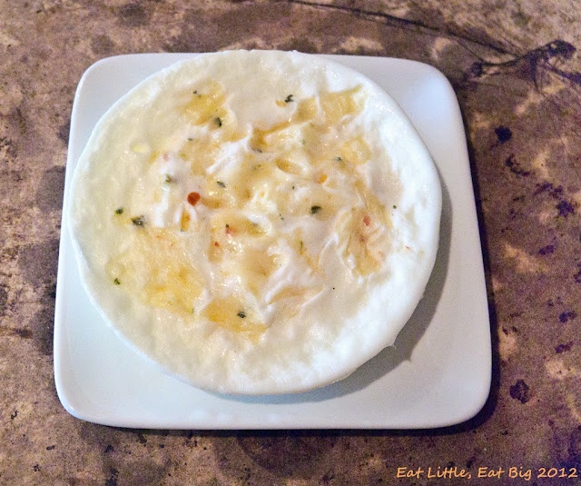 a white plate topped with food on top of a table