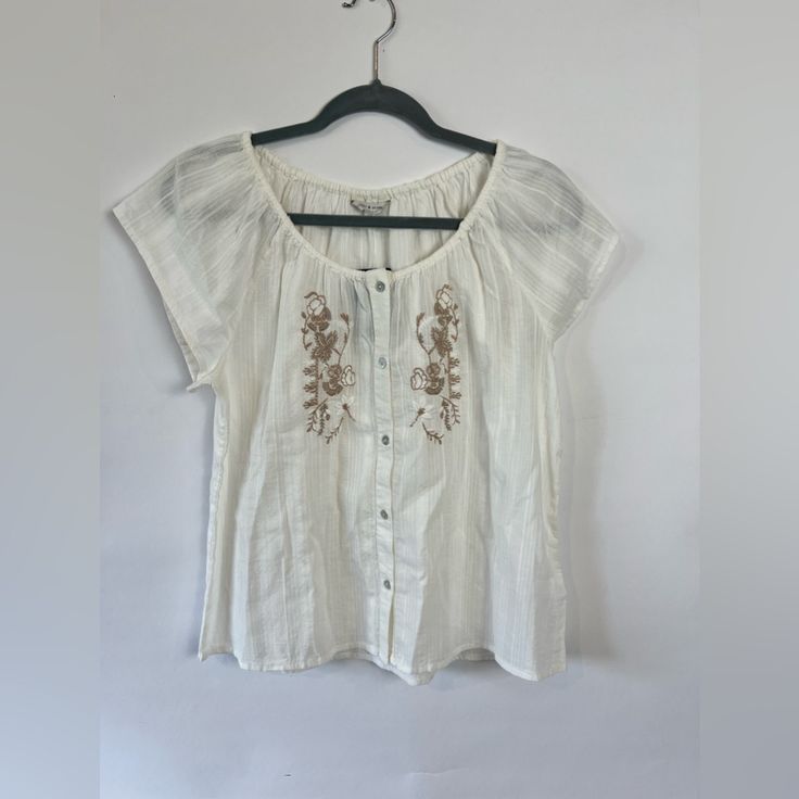 Lucky Brand Embroidered Short Sleeved Top Size Small Boho, Romantic Nwt, Retail $79.50 This Top Is White Cotton And Features Beautiful Beige Embroidery On The Front, Button Up Front, Short Sleeves, And Is Lightweight. A Lovely Top For Warm Weather. Feminine Embroidered White Tops, Elegant Floral Embroidery Top For Vacation, Elegant Floral Embroidered Top For Vacation, Cream Tops With Floral Embroidery, Relaxed Fit Floral Embroidery Blouse For Day Out, Relaxed Fit Blouse With Floral Embroidery For Day Out, Casual Cream Top With Floral Embroidery, Casual Cream Floral Embroidered Top, Casual Cream Embroidered Top With Floral Design