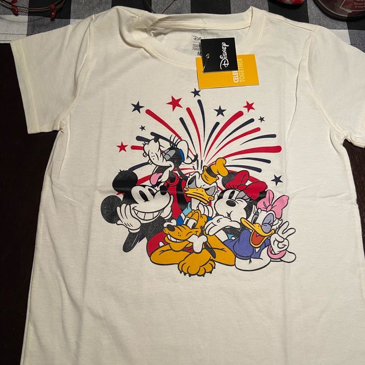 New With Tags Mickey And Friends Teeshirt Disney Size Child’s Medium For Anytime Of Year Or 4th Of July Casual Multicolor T-shirt For Disney Trips, Multicolor Cotton T-shirt For Disney Trips, White Mickey Mouse Crew Neck T-shirt, Mickey Mouse Graphic Tee Tops, Summer Cartoon Print Shirt For Disney Fan Events, Mickey Mouse Shirt For Disney Fan Events In Summer, White Mickey Mouse Top For Fans, White Disney Shirt For Summer, White Disney Crew Neck T-shirt